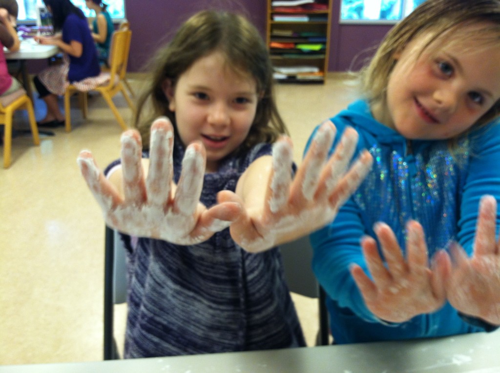 children making art with paint on their hands