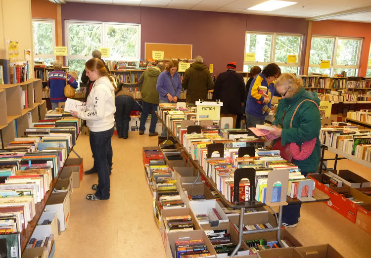 rows of tables with books for sale