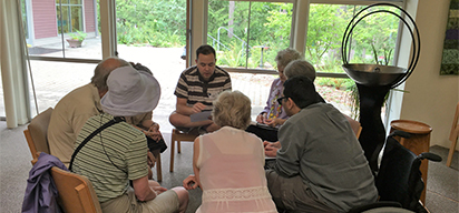 seven people sitting in a circle