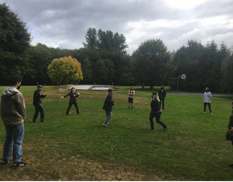 OUUC youth play a game called Statues