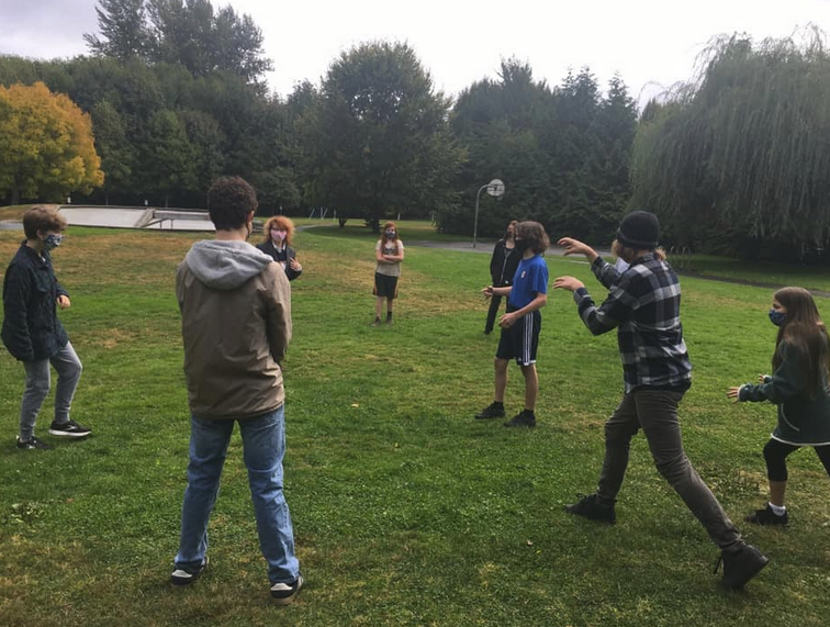 OUUC youth play a game called Statues