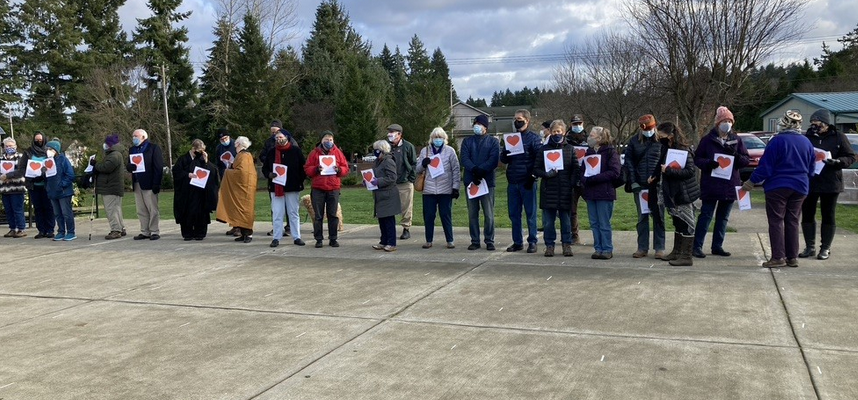 Community members in a row at Islamic Center